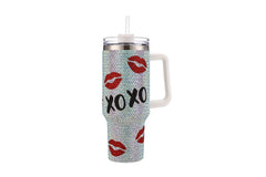 Blinged-out tumbler with lip prints and 'XOXO' text on a white background