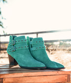 Elsa Leather Ankle Boots in teal suede with brass grommets and adjustable buckles