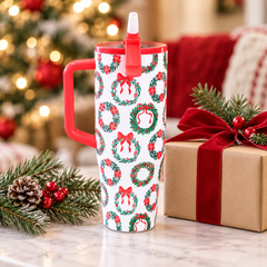 Ribbon Wreath tumbler beside a Christmas gift