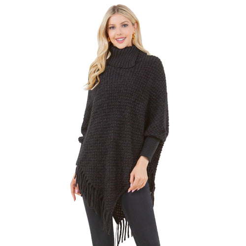 Knit cowl neck poncho with sleeves and fringe in black