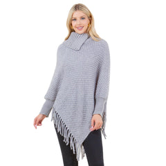 Knit cowl neck poncho with sleeves and fringe in gray