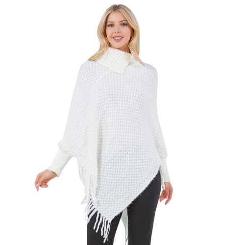 Knit cowl neck poncho with sleeves and fringe in ivory