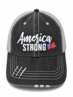 A distressed trucker-style baseball cap with a dark gray washed front panel and a light gray mesh back. The front features 'America STRONG' embroidered in white, with a small American flag graphic on the right side of the text.