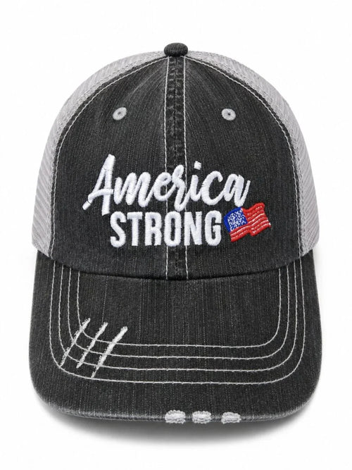 A distressed trucker-style baseball cap with a dark gray washed front panel and a light gray mesh back. The front features 'America STRONG' embroidered in white, with a small American flag graphic on the right side of the text.