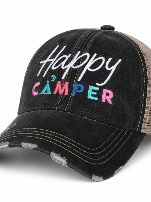 A black distressed trucker cap with 'Happy CAMPER' embroidered on the front. The cap features a black washed cotton front panel with white script 'Happy' and colorful 'CAMPER' lettering in pink, teal, and blue, paired with a brown mesh back.