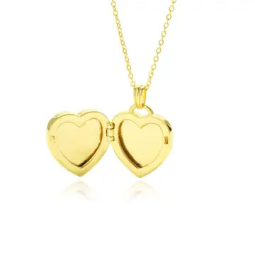 Gold vermeil heart locket opened showing inner compartments