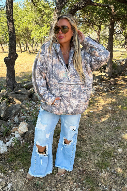 Outdoorsy Peyton Puffer Jacket in Woods Camo worn outdoors