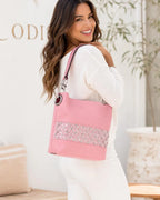 Pink rhinestone bling hobo handbag worn over the shoulder