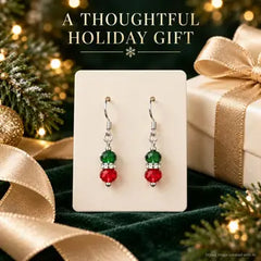 Pair of red green Christmas earrings displayed as a holiday gift