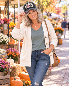 Woman wearing This Is My Fight Hat at an autumn market